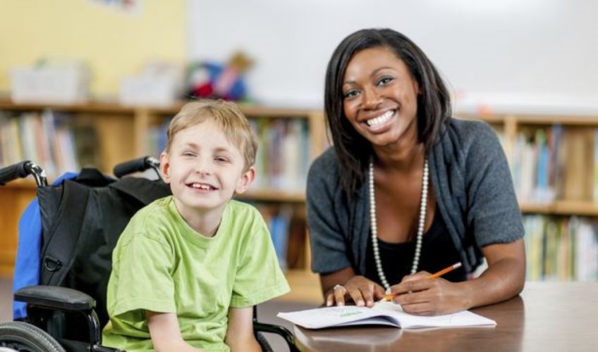 Special-Needs-Boy-with-his-teacher-at-school